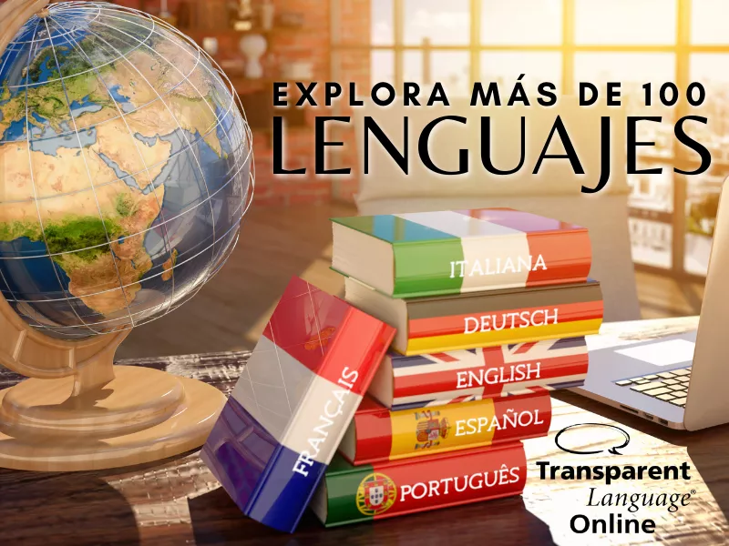 Imagen de varios libros de idiomas apilados en una mesa junto con un globo terráqueo y una computadora portátil al lado