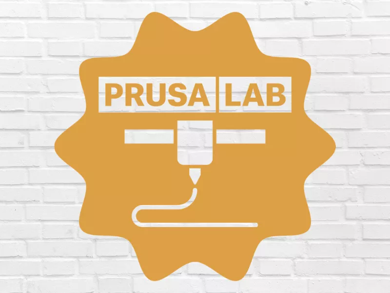 Prusa Lab logo on orange with brick background